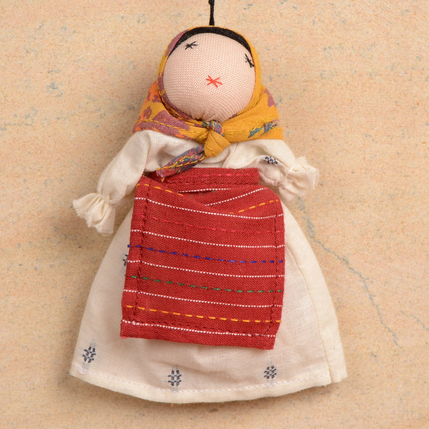 Eco-friendly Olga_01 doll hanging for festive home decoration, measuring 11 x 8 cm, showcasing vibrant colors and unique design.