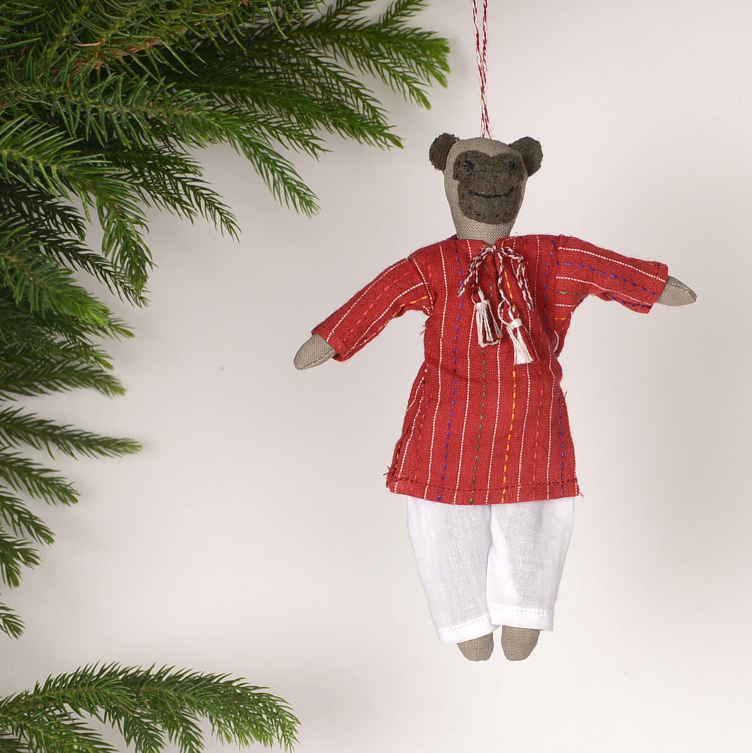 Eco-friendly Orn_Neelu doll hanging for festive home decoration, measuring 14 x 13 cm, showcasing vibrant colors and intricate design.