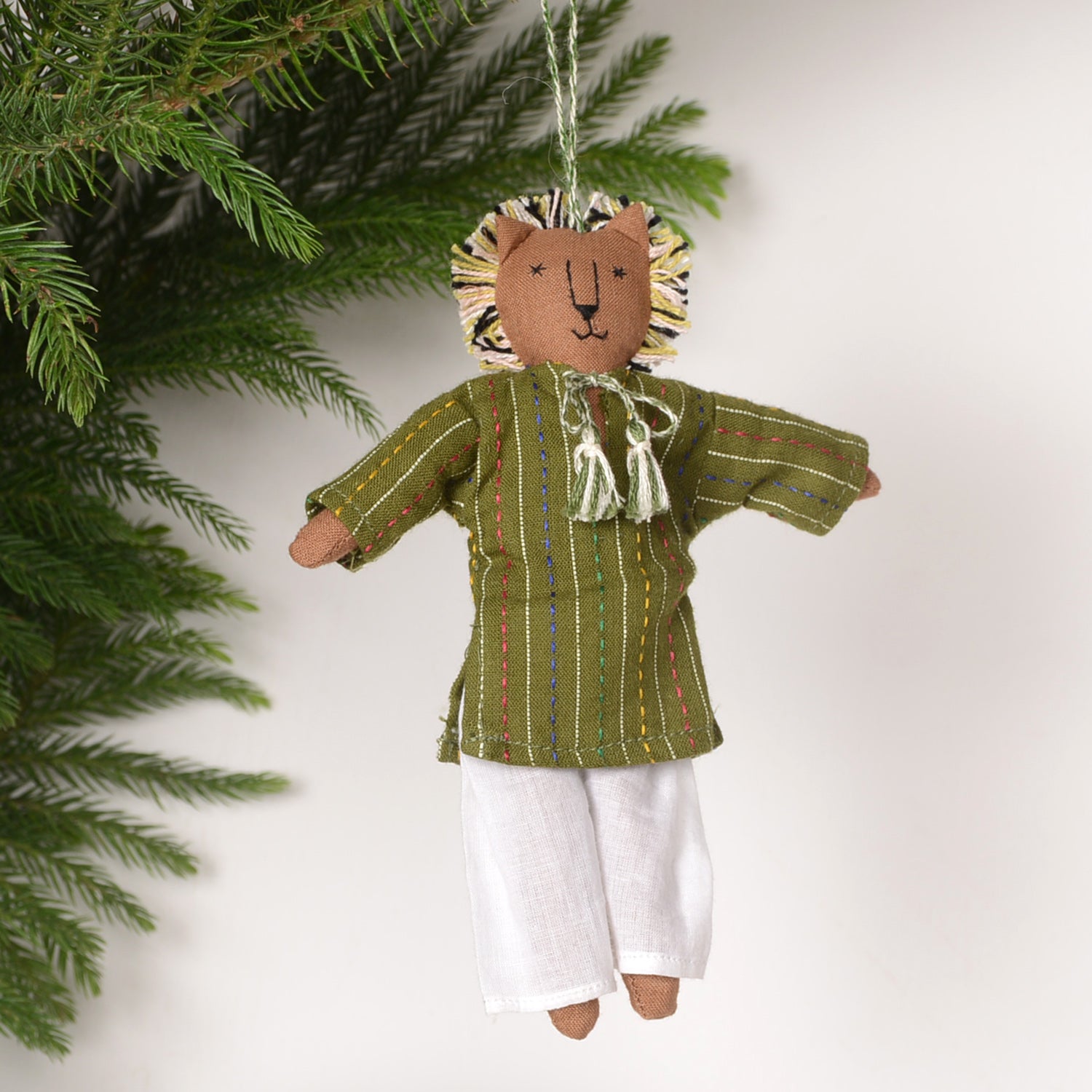 Eco-friendly doll hanging named Orn_Kom, beautifully designed for festive home decoration, measuring 14 x 13 cm.