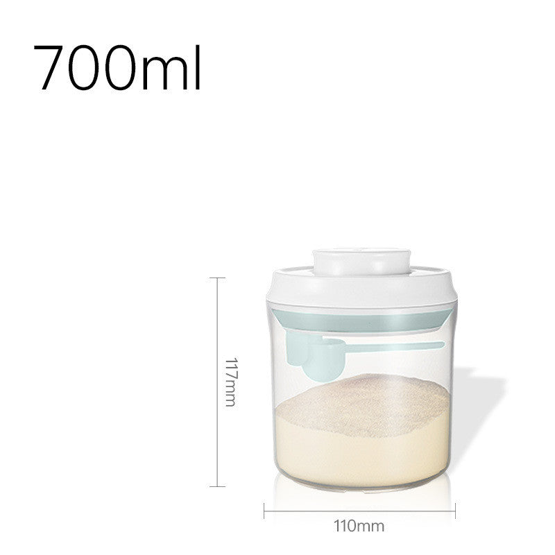 Transparent milk powder box with a one-key push-open lid, designed for moisture-proof storage and includes a hanging spoon for hygiene.