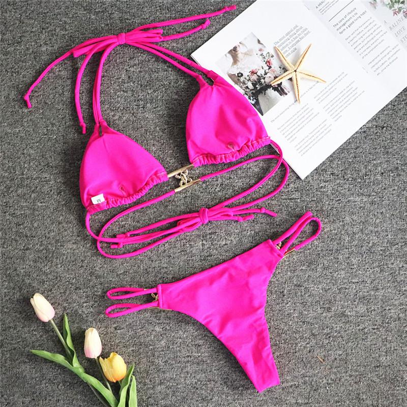 A luxurious women's bikini adorned with rhinestones and diamonds, featuring a low waist design and elegant style, perfect for beach outings.