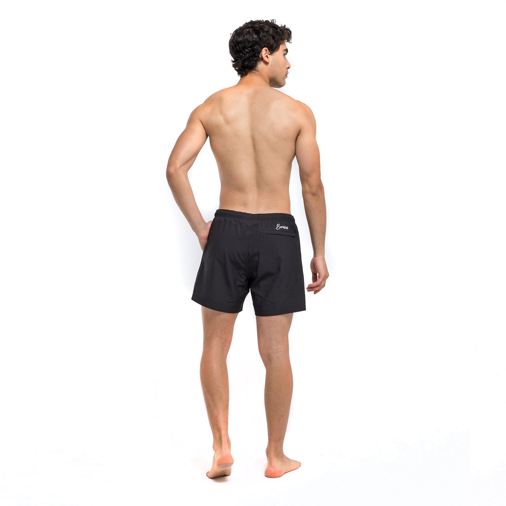 Black Avocado performance shorts featuring a compression liner and pockets, designed for training and workouts.