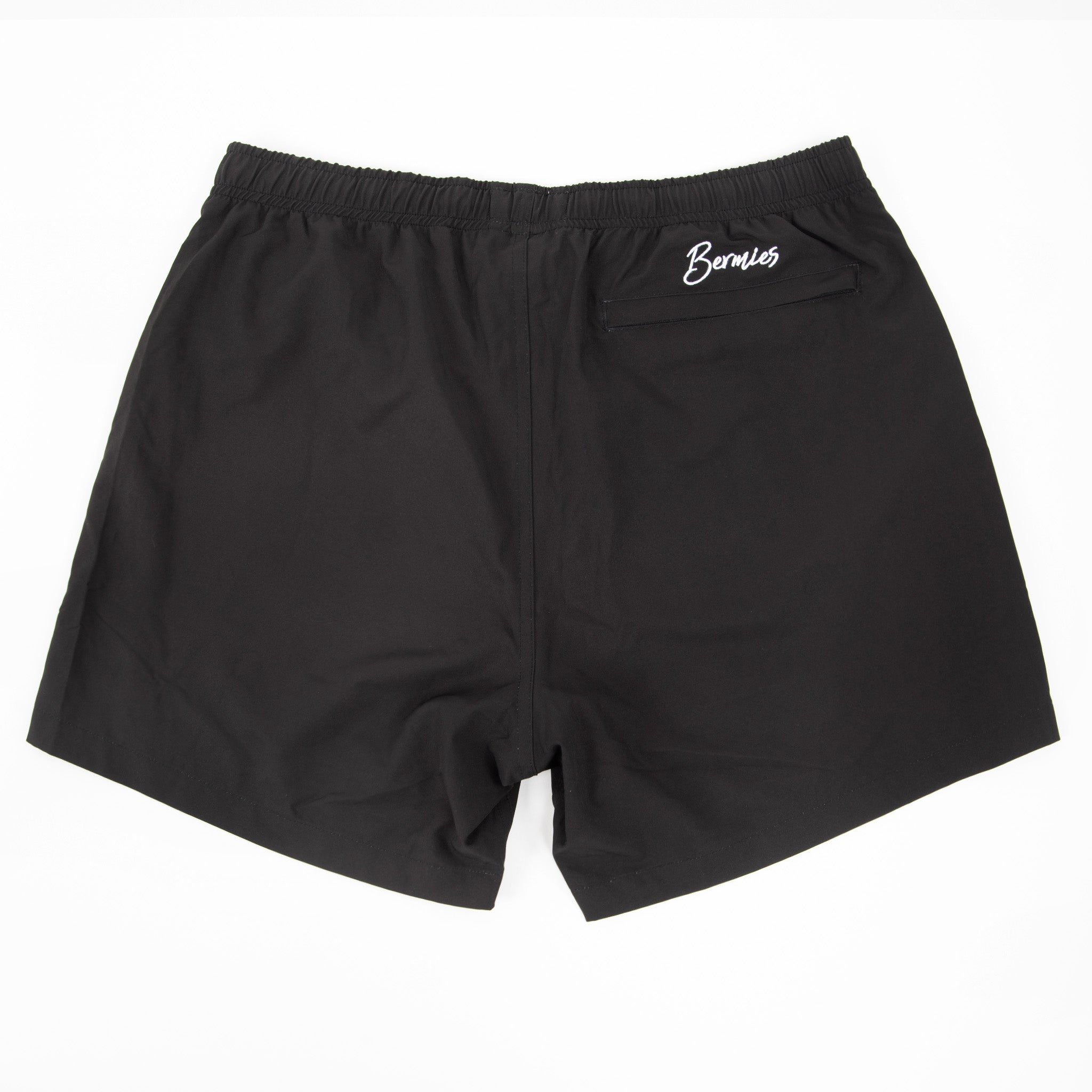 Black Avocado performance shorts featuring a compression liner and pockets, designed for training and workouts.