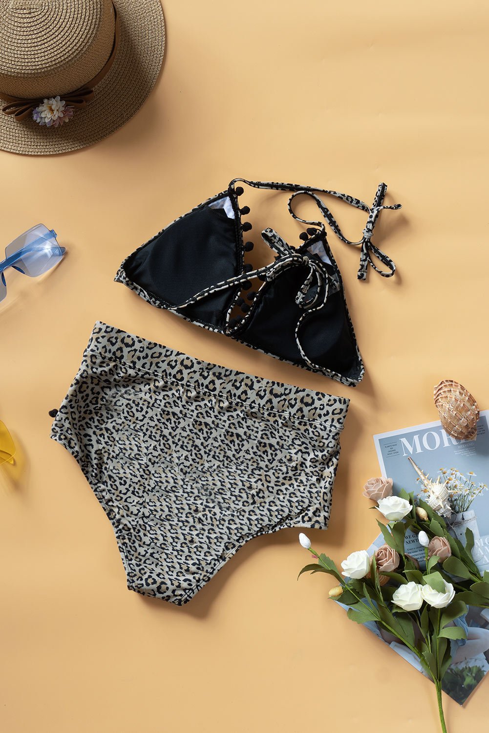 Black Leopard Stripe High Waist Bikini with tassel trim, featuring a sexy low v-neck top and high-waisted bottom, perfect for summer beach outings.