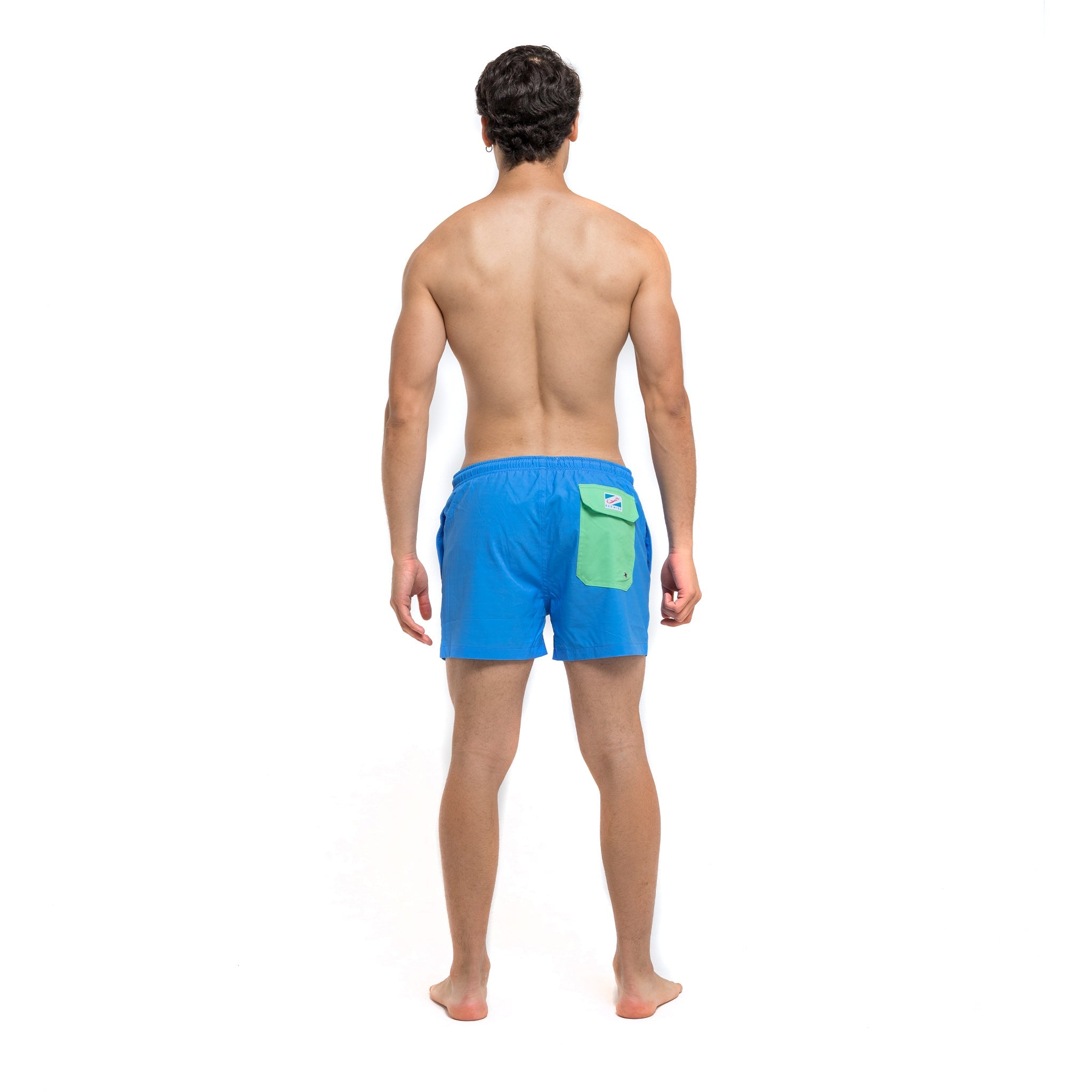 Blue swim trunks with green pocket, featuring a stylish design and eco-friendly materials.