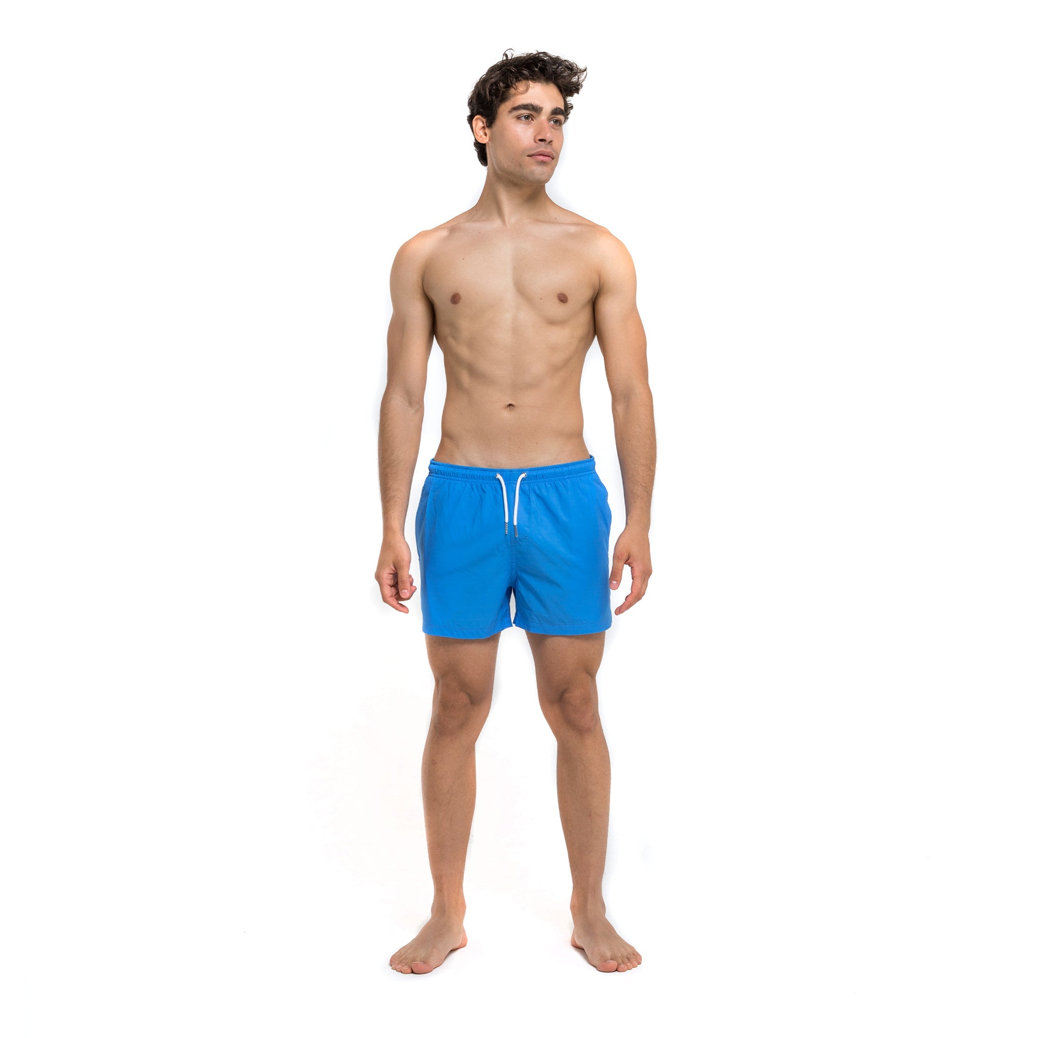 Blue swim trunks with green pocket, featuring a stylish design and eco-friendly materials.