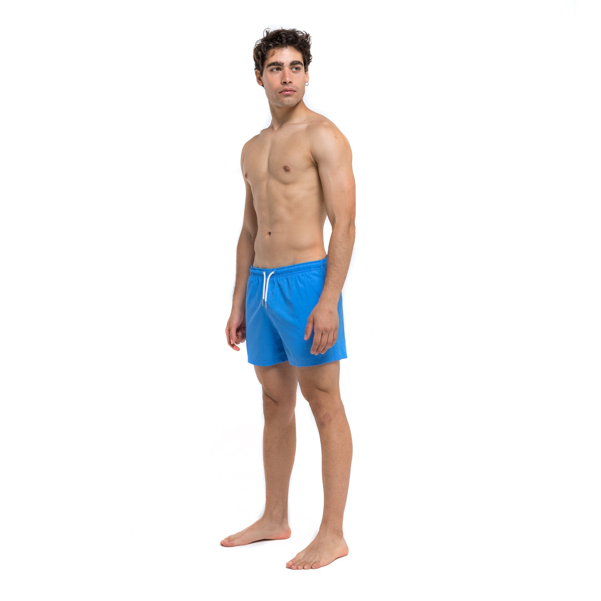 Blue swim trunks with green pocket, featuring a stylish design and eco-friendly materials.