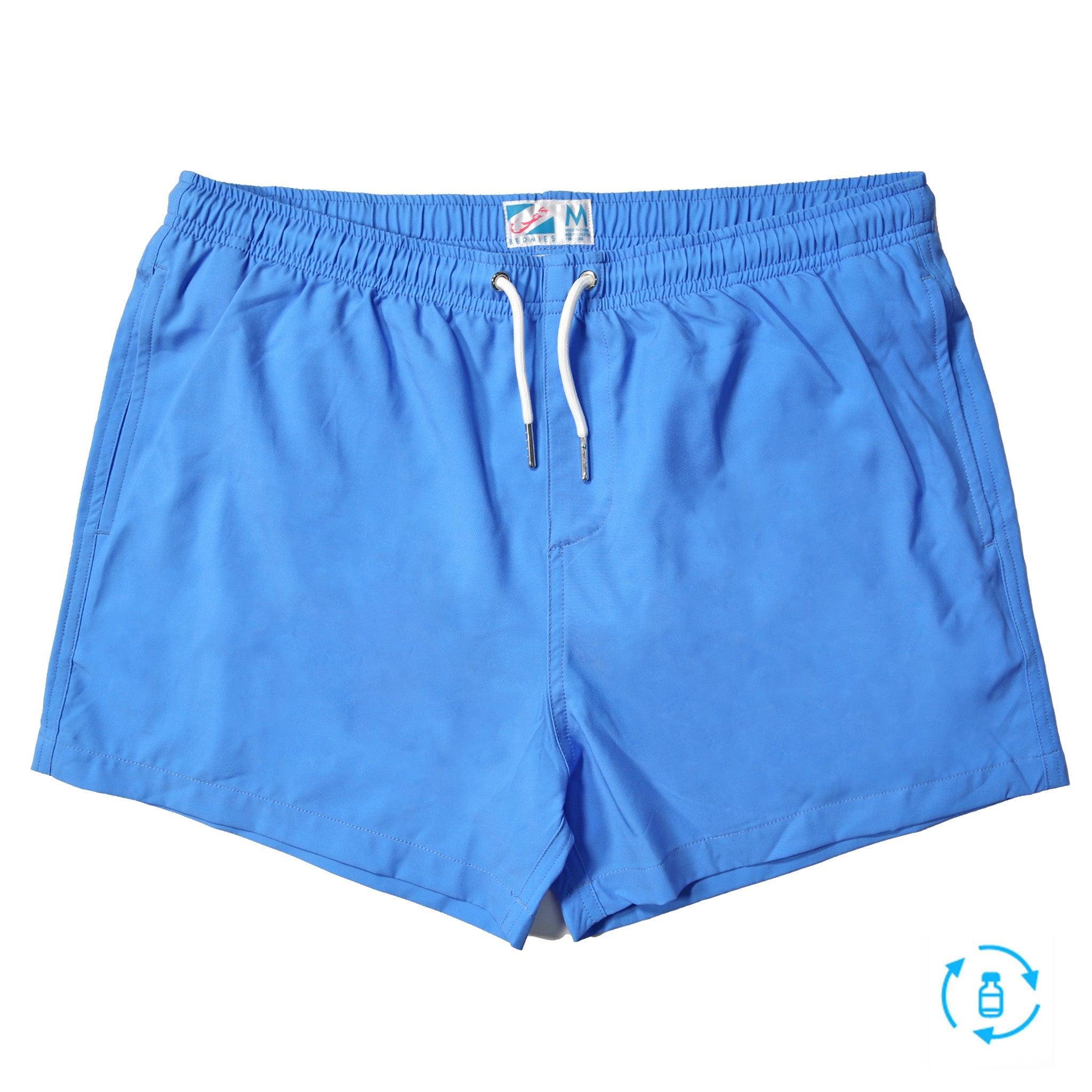 Blue swim trunks with green pocket, featuring a stylish design and eco-friendly materials.