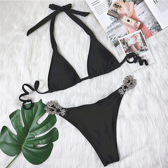 A stylish black diamond bikini featuring a sexy push-up halter design with crystal embellishments, perfect for summer beach outings.