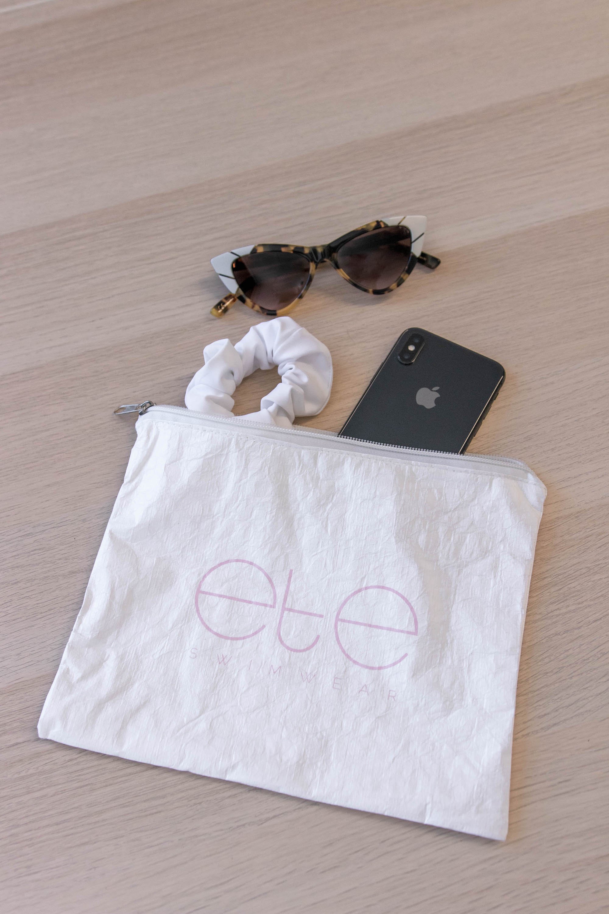 Ete Swimwear Splash-Proof Beach Bag in light pink, showcasing its stylish design and zip closure.