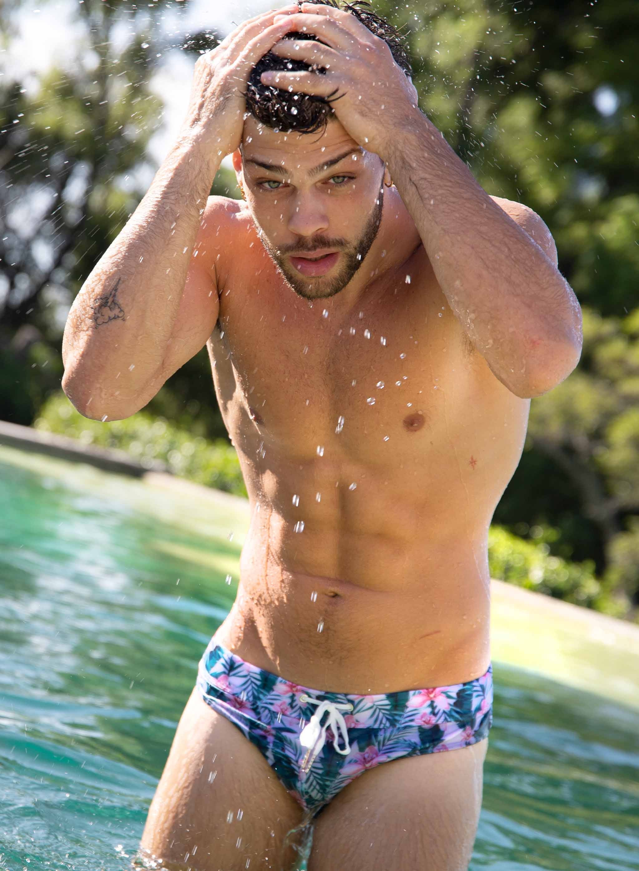 Jungle Swim Briefs featuring vibrant patterns and elastic waistband, perfect for beach and pool activities.