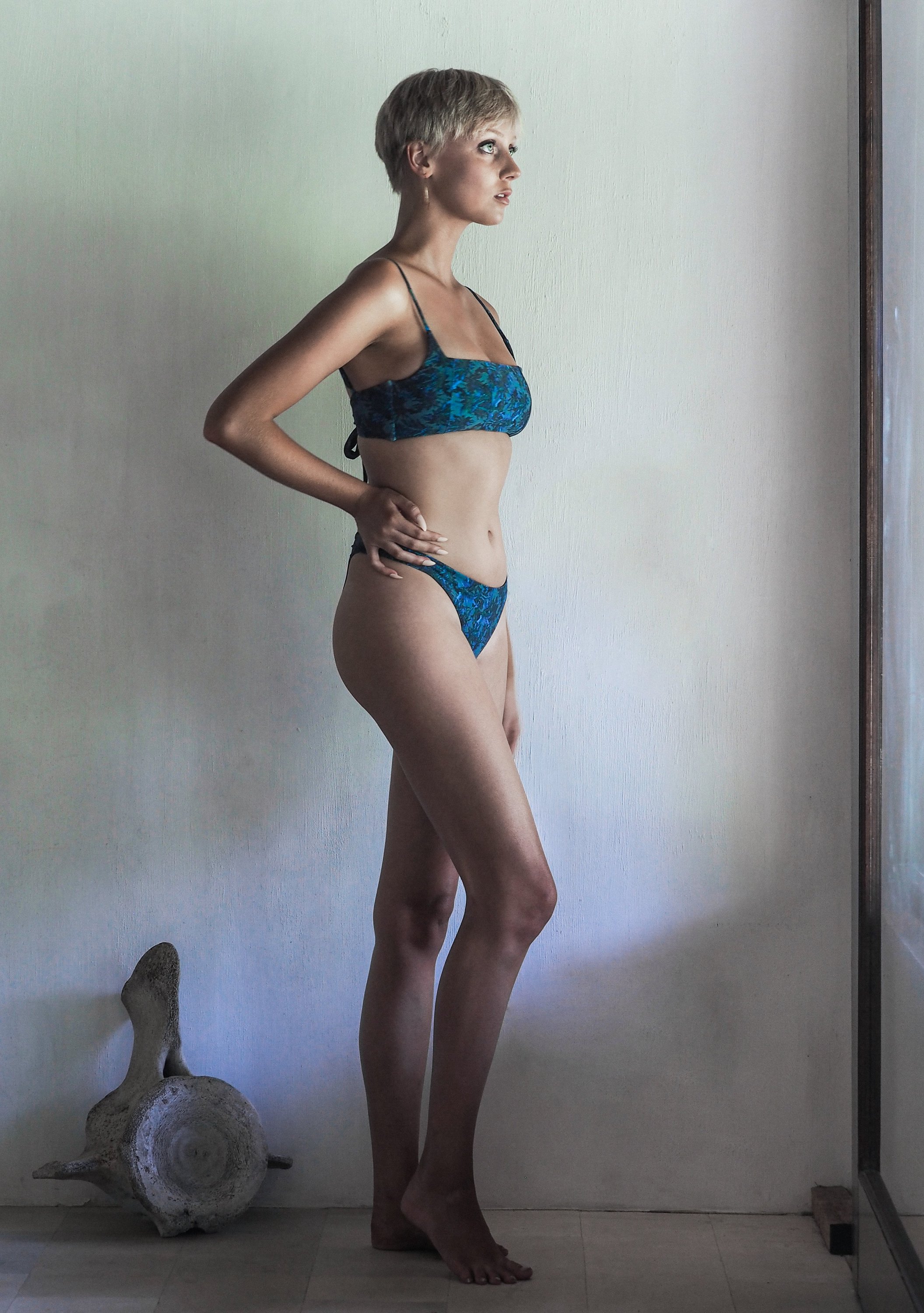 LYDIA BOTTOM in SEA JUNGLE featuring a khaki base with blue and green foliage, showcasing a flattering cheeky cut.