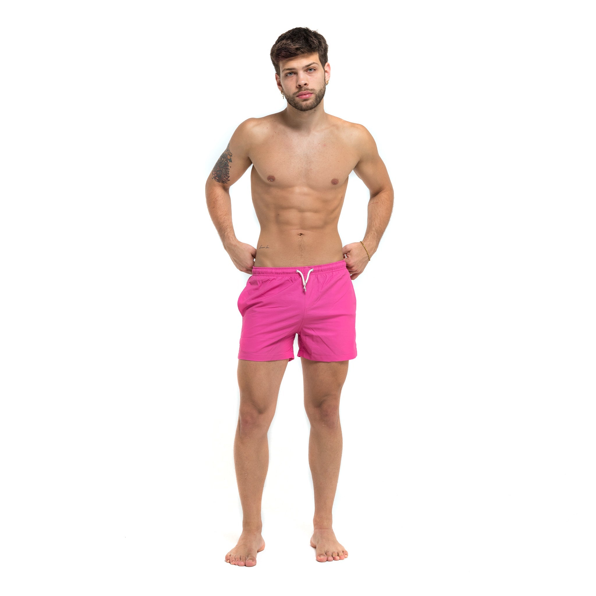 Magenta blue swim trunks with pockets and elastic key loop, designed for comfort and style.