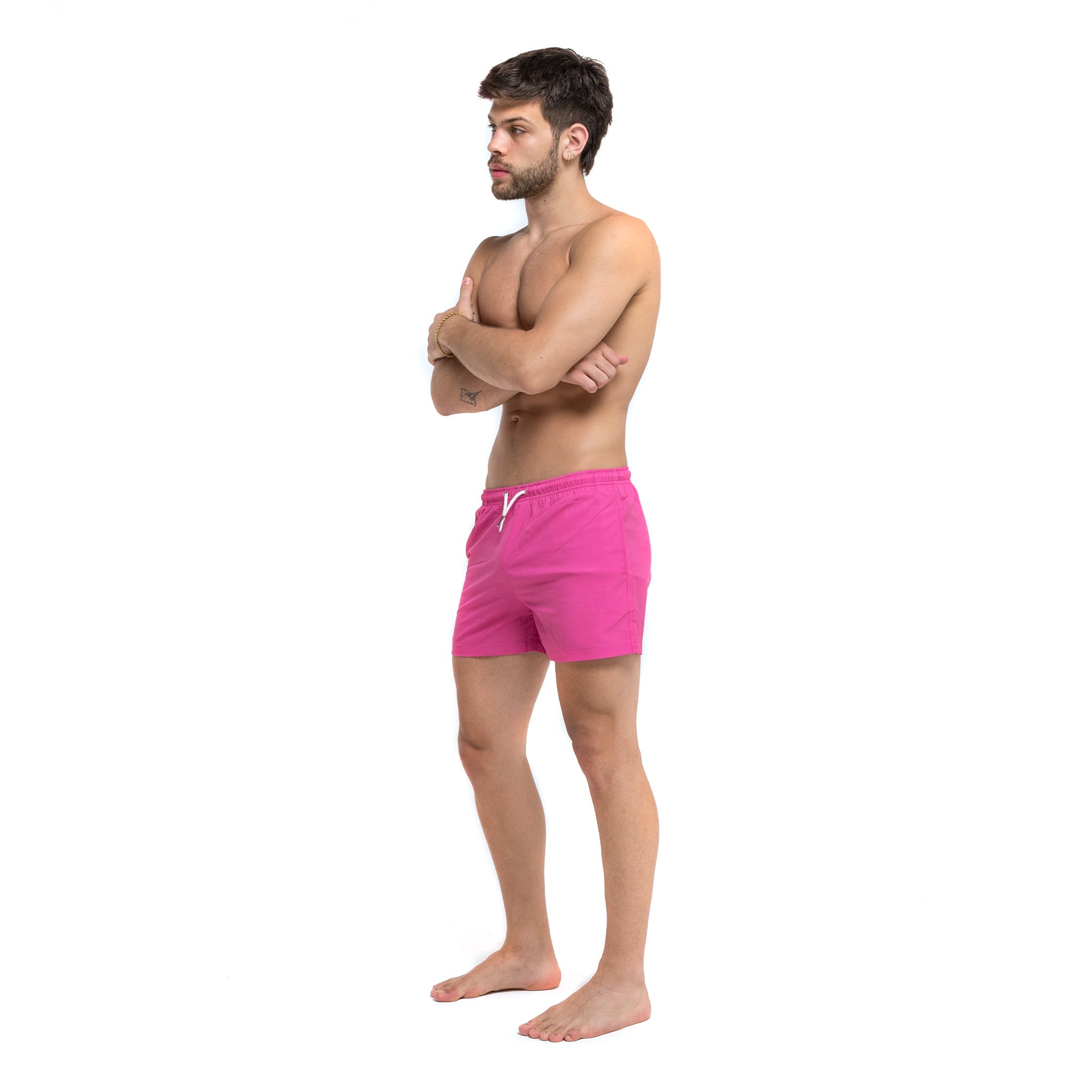 Magenta blue swim trunks with pockets and elastic key loop, designed for comfort and style.