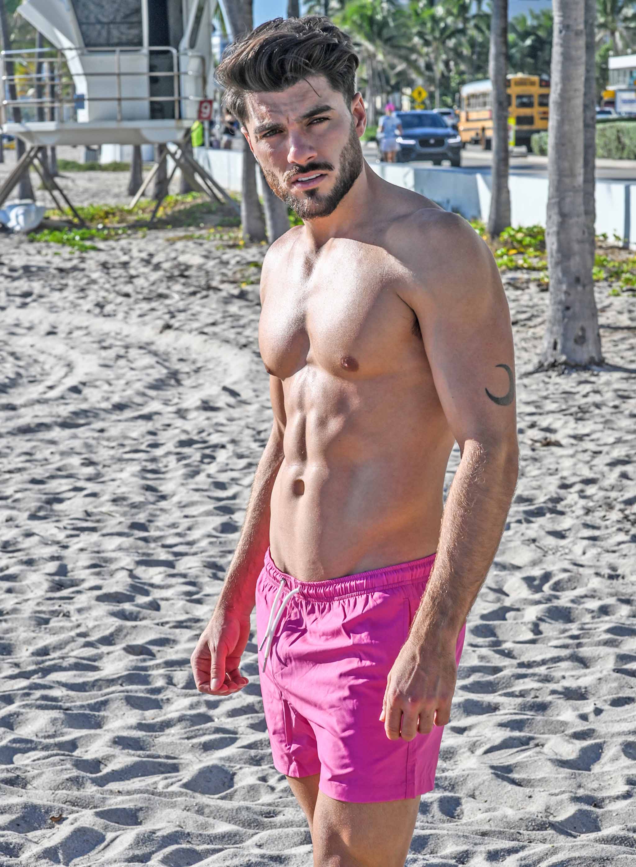 Magenta blue swim trunks with pockets and elastic key loop, designed for comfort and style.