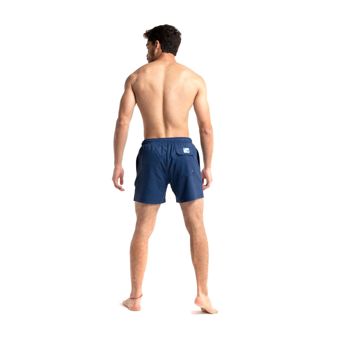 Navy swim trunks made from recycled materials, featuring a stylish design and comfortable mesh liner.