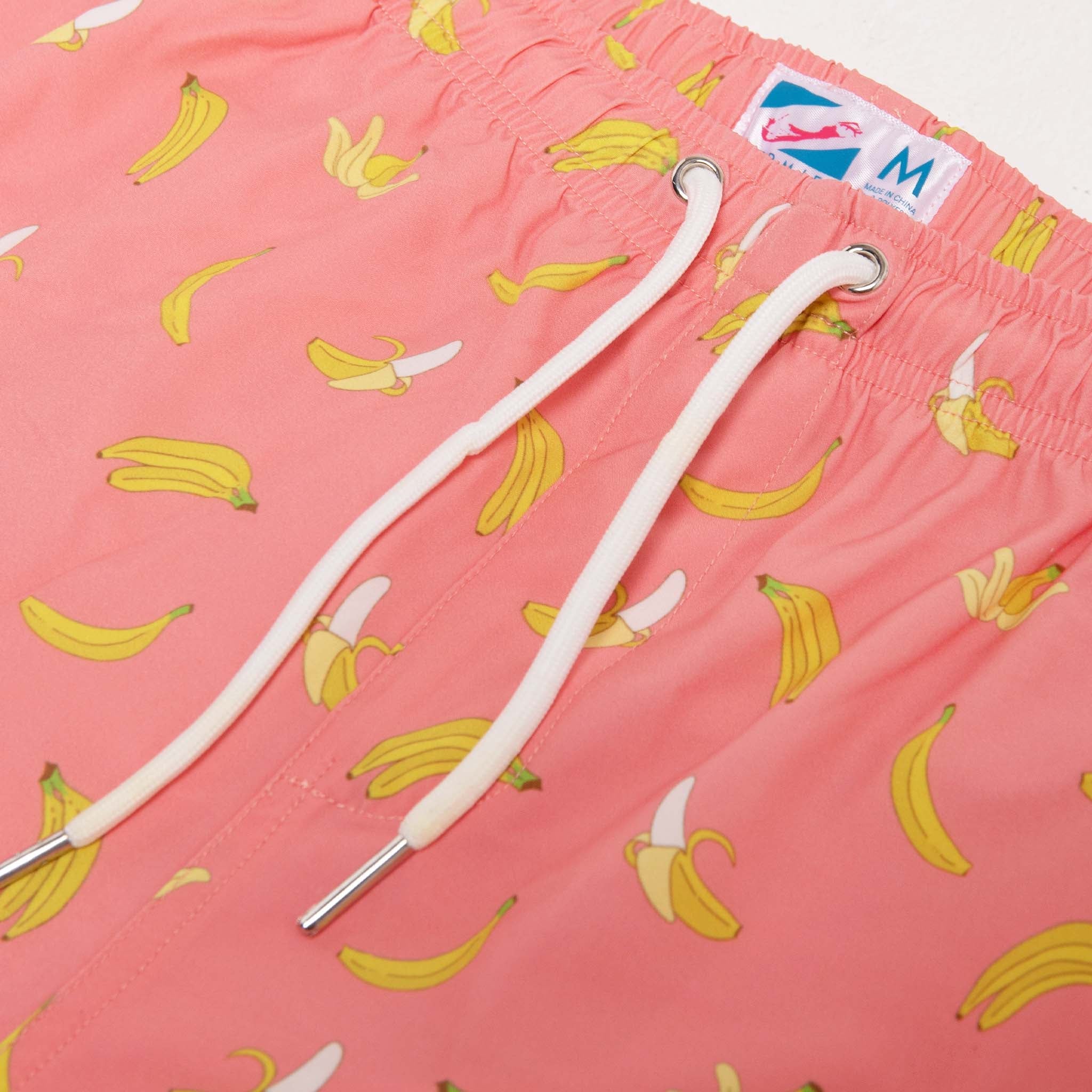 Pink Banana 5" Swim Trunks made from recycled materials, featuring a stylish design and eco-friendly attributes.