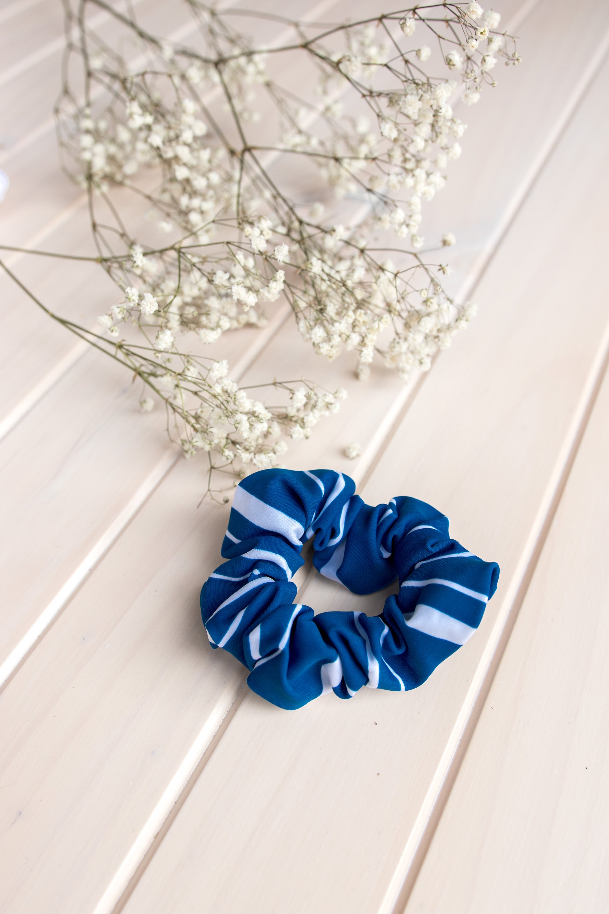 Navy Stripes Scrunchie Hair Tie made from soft swimwear fabric, featuring a stylish striped design perfect for summer.