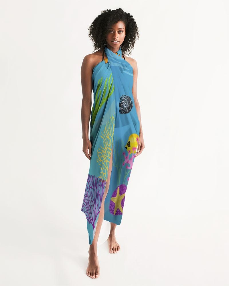 A stylish sheer aquatic blue swimsuit cover-up with a vibrant fish print, perfect for beach and poolside wear.