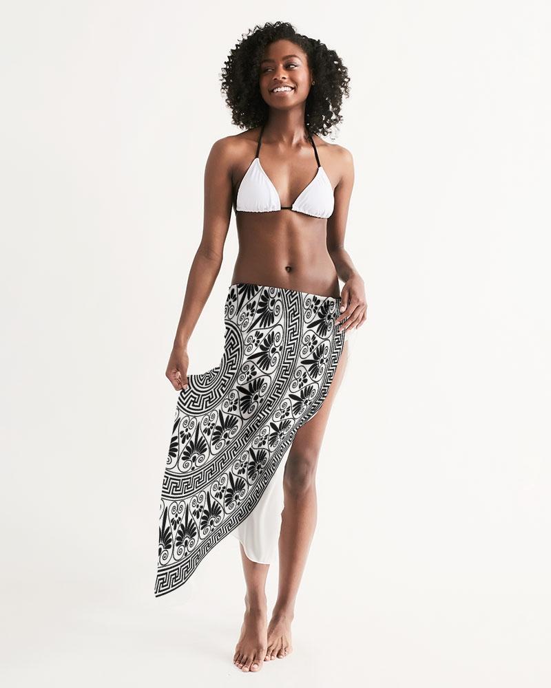 A stylish sheer black bohemian swimsuit cover-up with intricate patterns, perfect for beach or poolside wear.