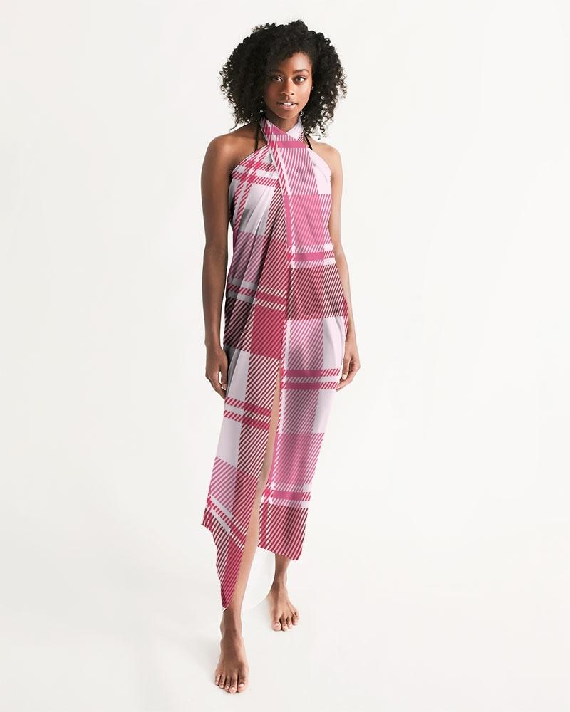 A stylish sheer plaid pink swimsuit cover up draped elegantly, showcasing its lightweight fabric and self-tie closure.