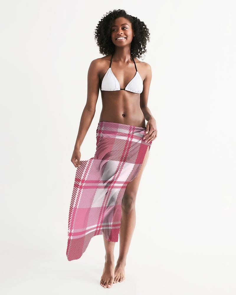 A stylish sheer plaid pink swimsuit cover up draped elegantly, showcasing its lightweight fabric and self-tie closure.