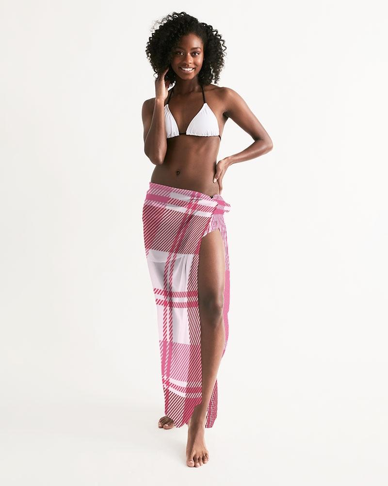 A stylish sheer plaid pink swimsuit cover up draped elegantly, showcasing its lightweight fabric and self-tie closure.