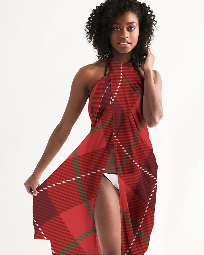 A stylish sheer plaid red swimsuit cover up draped elegantly, showcasing its lightweight fabric and self-tie closure.