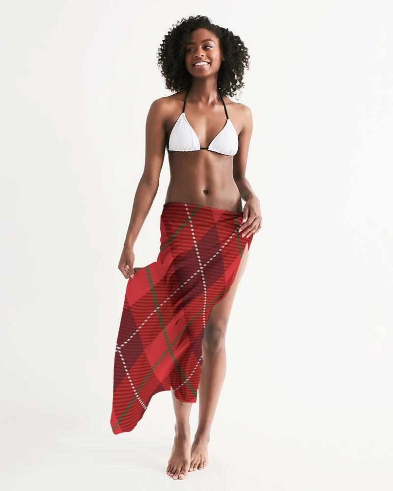 A stylish sheer plaid red swimsuit cover up draped elegantly, showcasing its lightweight fabric and self-tie closure.