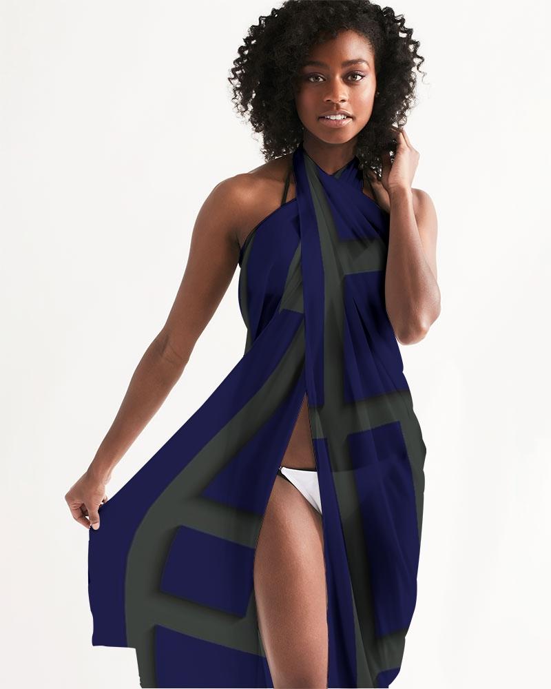 A sheer sarong swimsuit cover up wrap featuring a geometric dark blue and green design, perfect for beach and poolside wear.