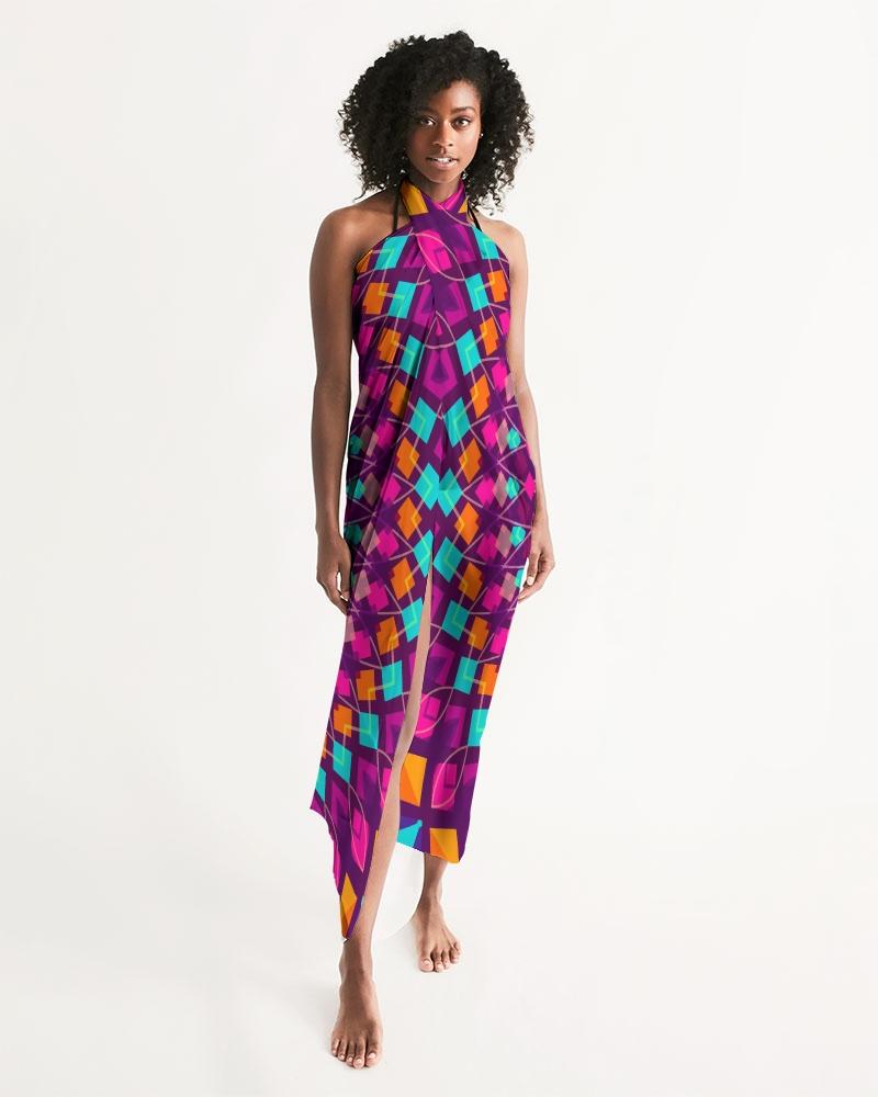 A vibrant purple kaleidoscope patterned sheer sarong swimsuit cover up wrap, elegantly draped on a model, showcasing its lightweight and flowy fabric.