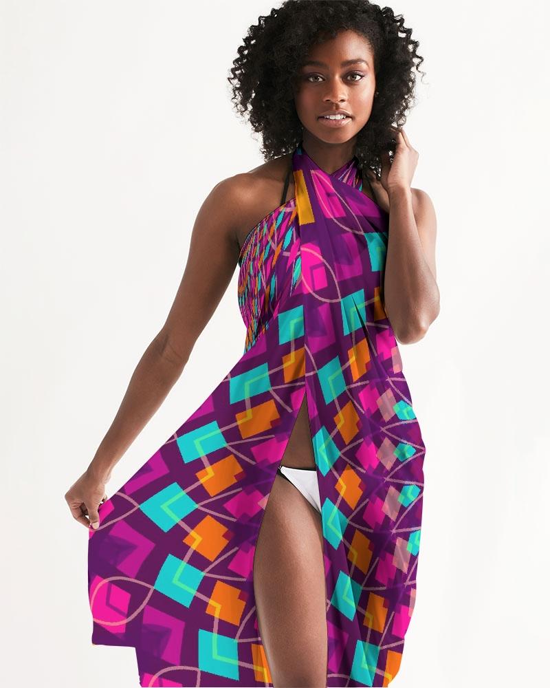 A vibrant purple kaleidoscope patterned sheer sarong swimsuit cover up wrap, elegantly draped on a model, showcasing its lightweight and flowy fabric.