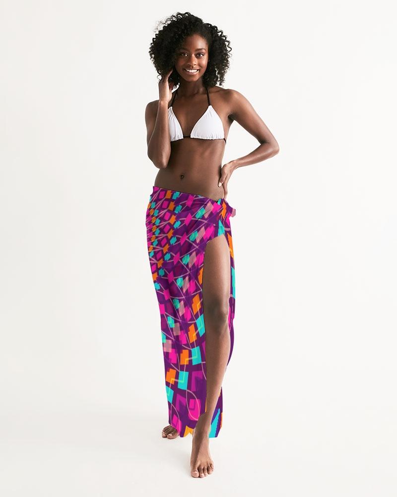 A vibrant purple kaleidoscope patterned sheer sarong swimsuit cover up wrap, elegantly draped on a model, showcasing its lightweight and flowy fabric.