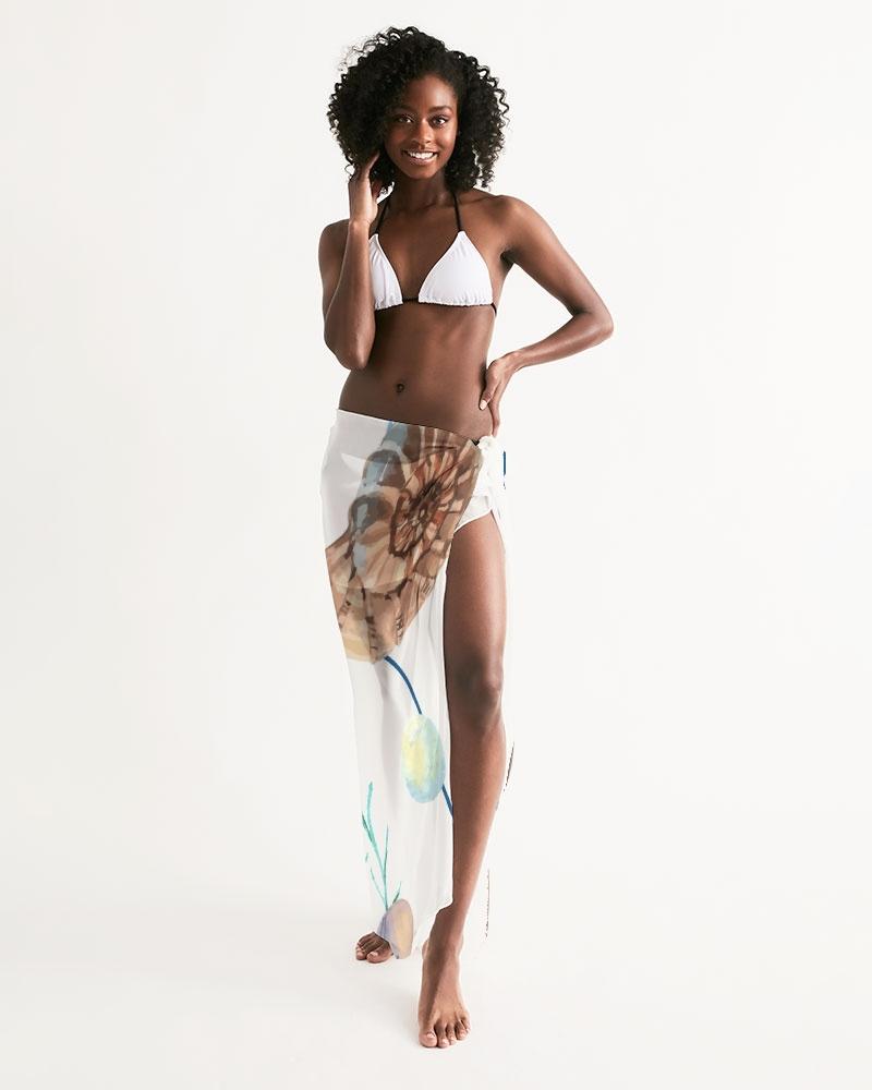 A lightweight sheer sarong swimsuit cover up wrap in white seashell design, perfect for beach or poolside wear.