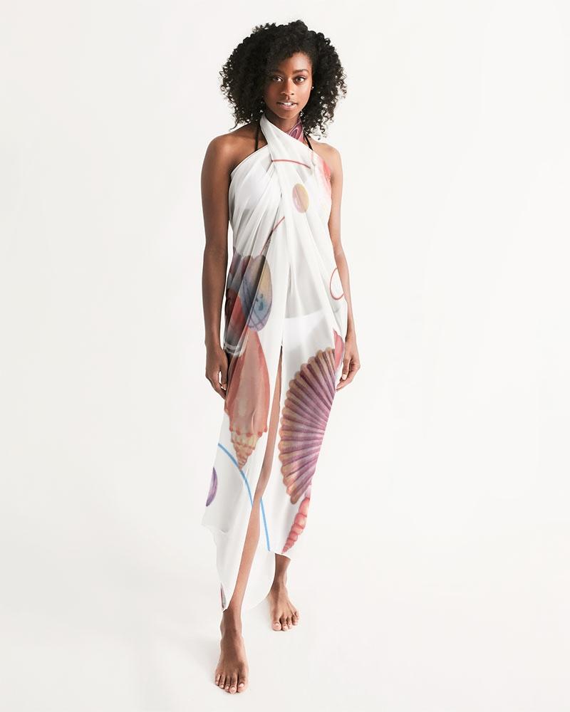 A lightweight and flowy sheer swimsuit cover-up featuring ocean-themed prints, perfect for beach or poolside wear.