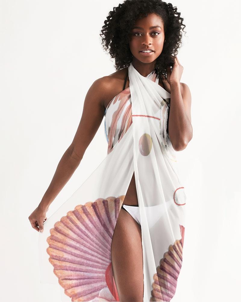 A lightweight and flowy sheer swimsuit cover-up featuring ocean-themed prints, perfect for beach or poolside wear.