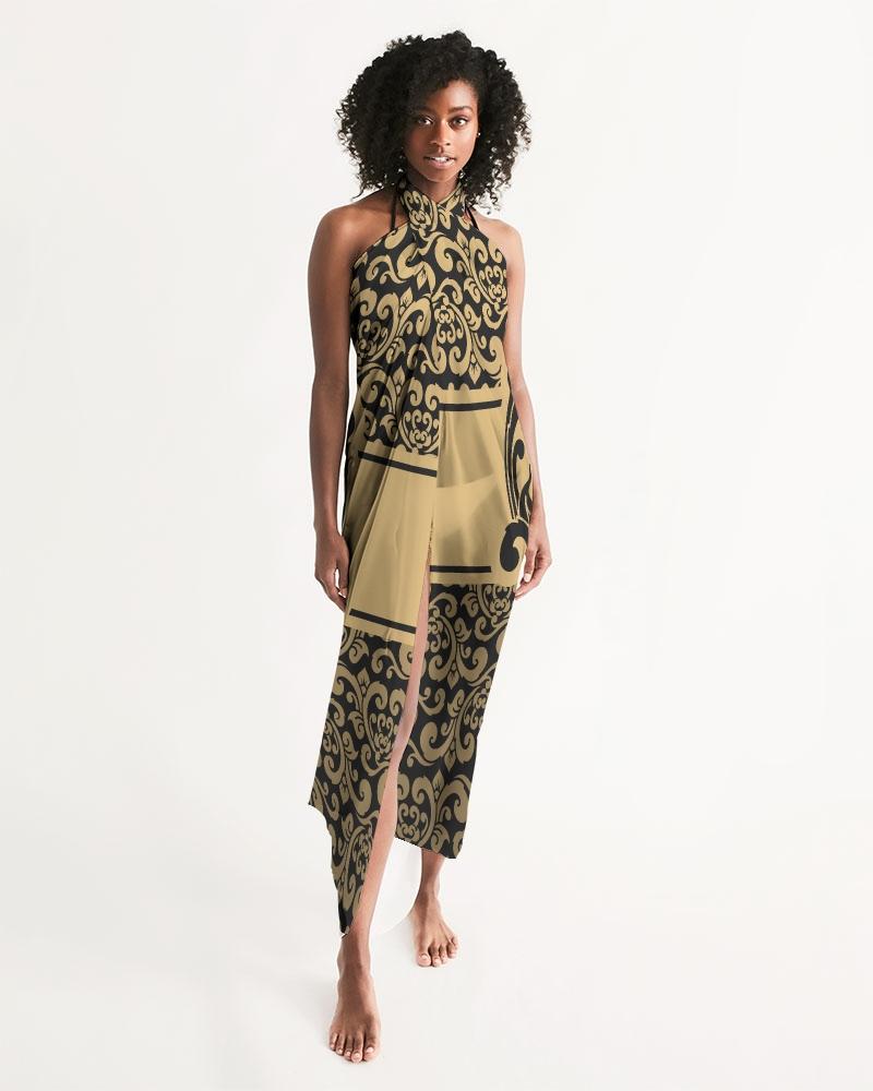 Sheer swimsuit cover up featuring an abstract black and gold print, perfect for beach or poolside wear.