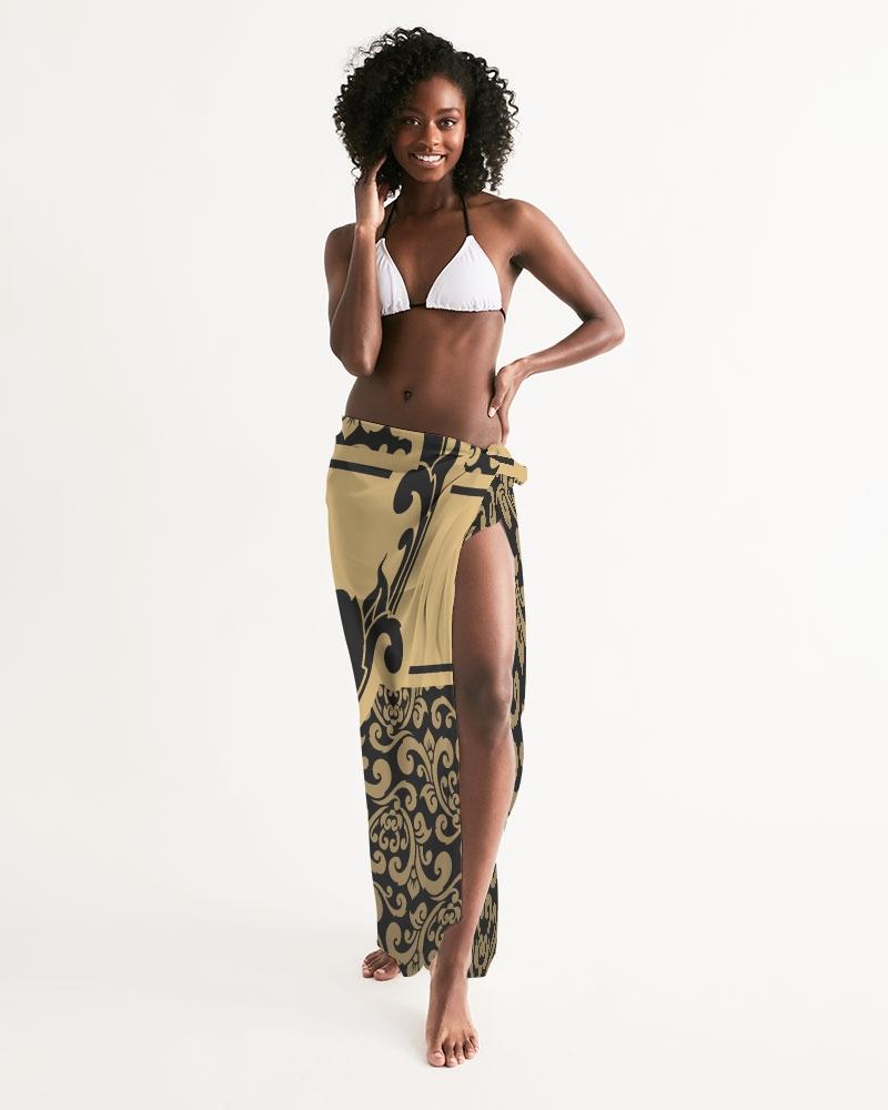 Sheer swimsuit cover up featuring an abstract black and gold print, perfect for beach or poolside wear.