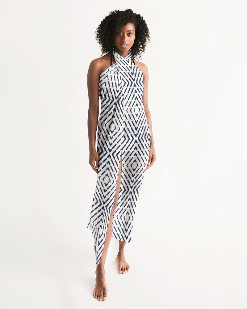 A stylish sheer swimsuit cover up featuring a black and white abstract print, perfect for beach or poolside wear.