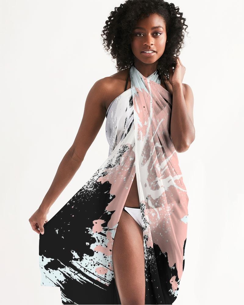 A lightweight sheer swimsuit cover up featuring an abstract pastel paint splatter design, perfect for beach or pool wear.