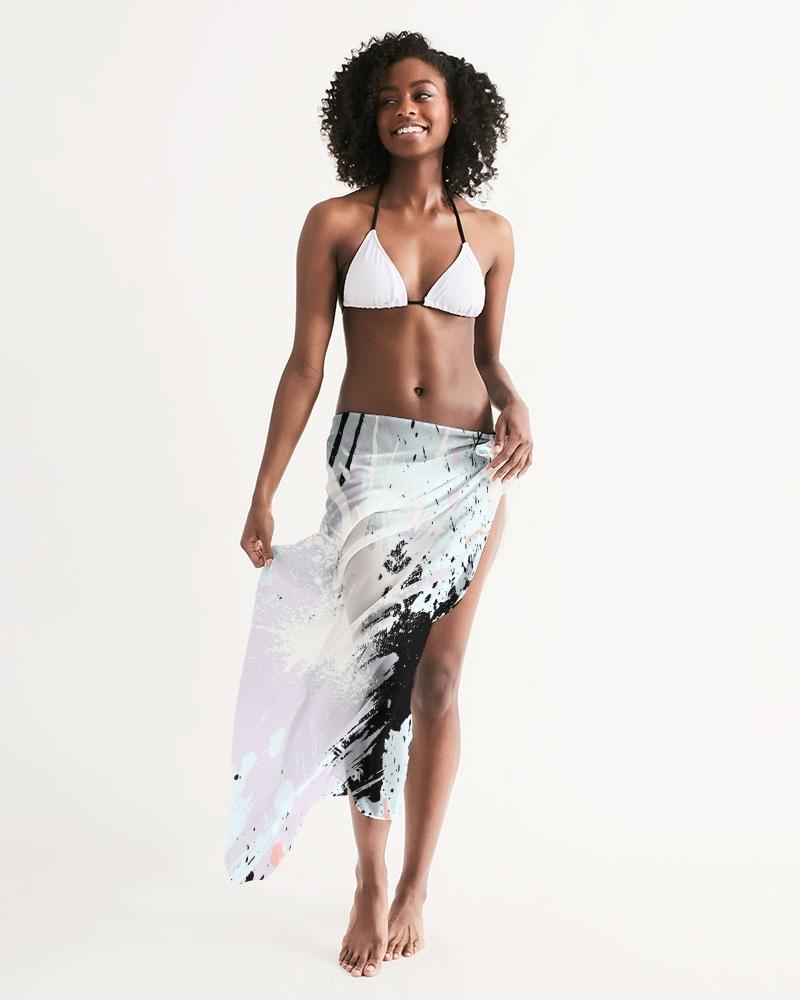 A lightweight sheer swimsuit cover up featuring an abstract pastel paint splatter design, perfect for beach or pool wear.