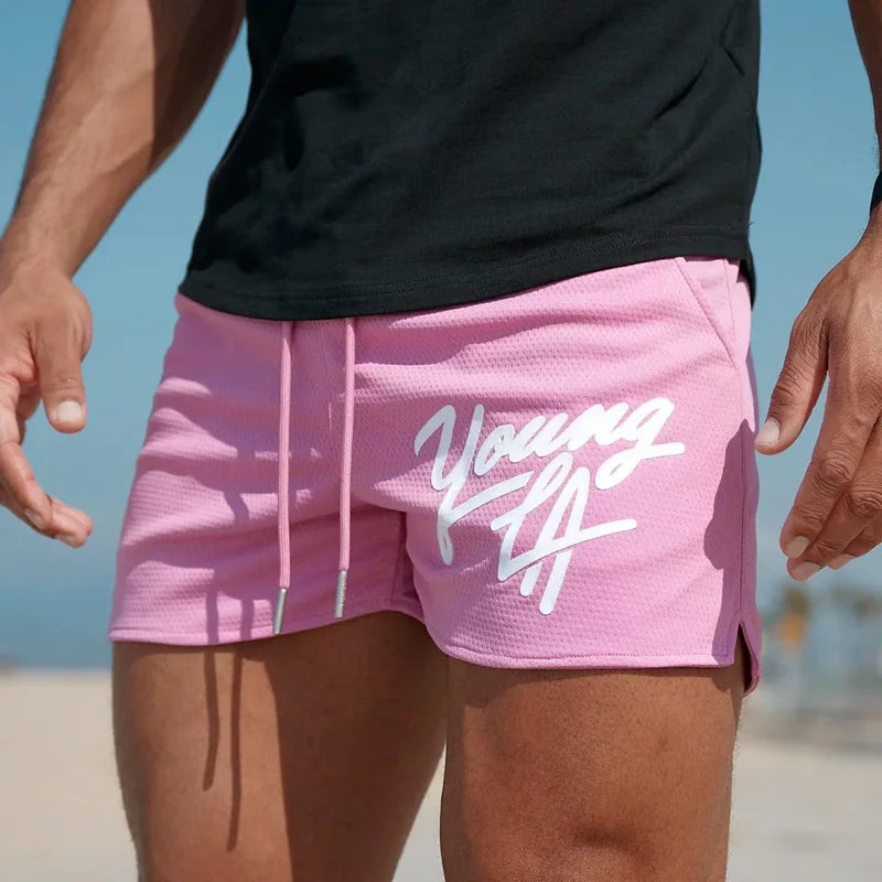 Young LA Trendy Beach Shorts for men, featuring stylish prints and an elastic waist for comfort.