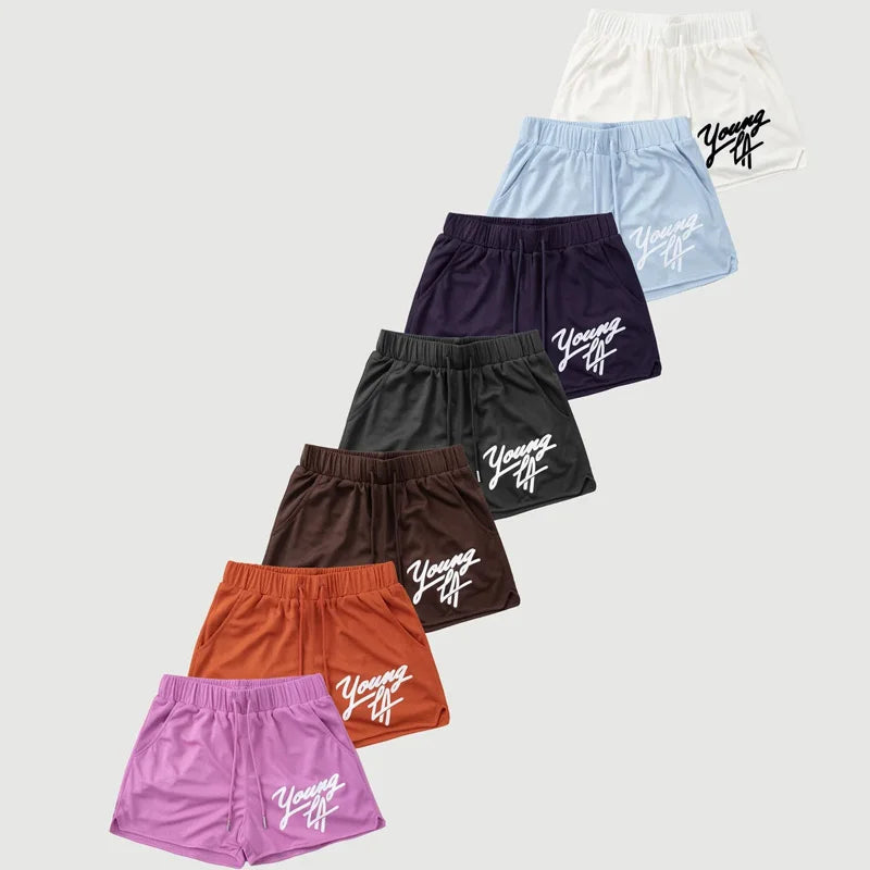 Young LA Trendy Beach Shorts for men, featuring stylish prints and an elastic waist for comfort.