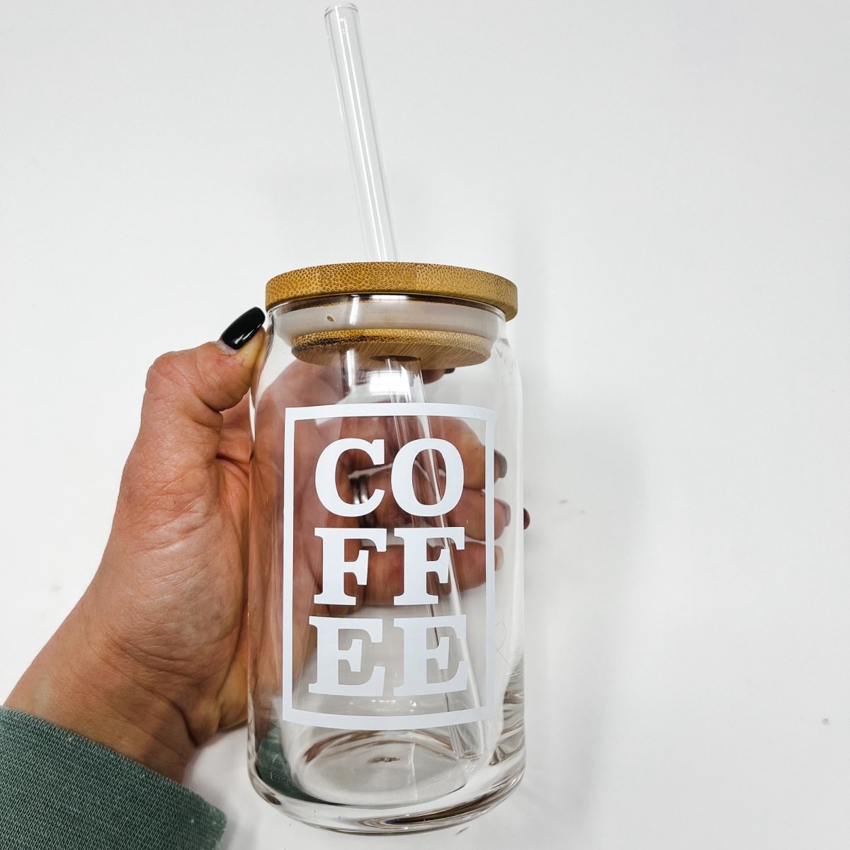 A stylish 16 oz Beer Can Glass designed for serving iced coffee, soda, and beer, featuring a unique handmade vinyl design.