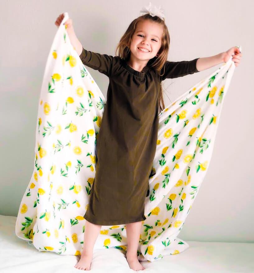 4 Layer Muslin Quilt with Lemon Print, showcasing its soft texture and vibrant design, perfect for babies and toddlers.