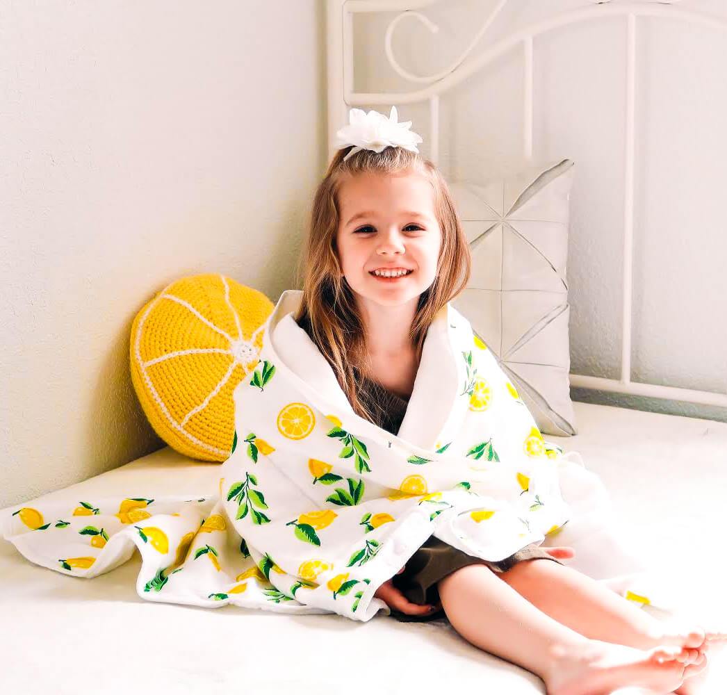 4 Layer Muslin Quilt with Lemon Print, showcasing its soft texture and vibrant design, perfect for babies and toddlers.