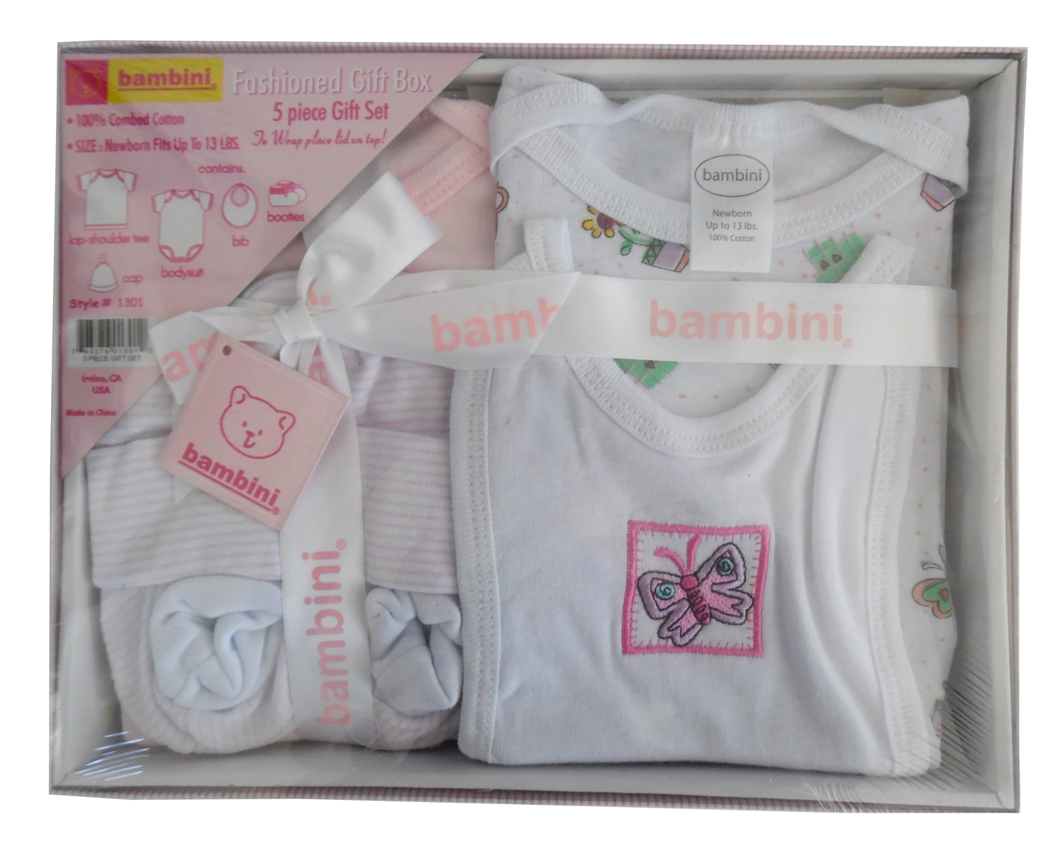 5 Piece Gift Box in pastel pink featuring a t-shirt, onezie bodysuit, bib, hat, and booties, all made from soft cotton.