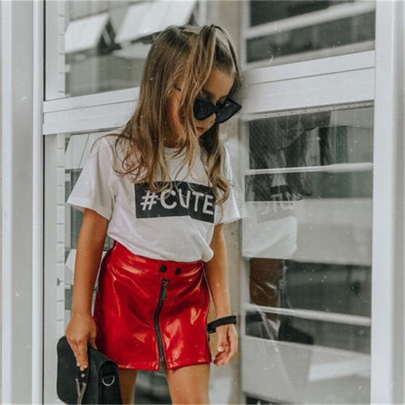 Young girl in fashionable outfit.