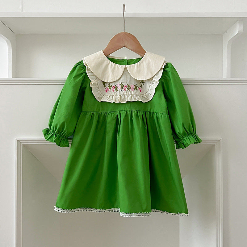 A stylish Arrival Autumn Baby Kids Girls dress featuring long sleeves and a Peter Pan collar in green and beige colors, adorned with an embroidered pattern.