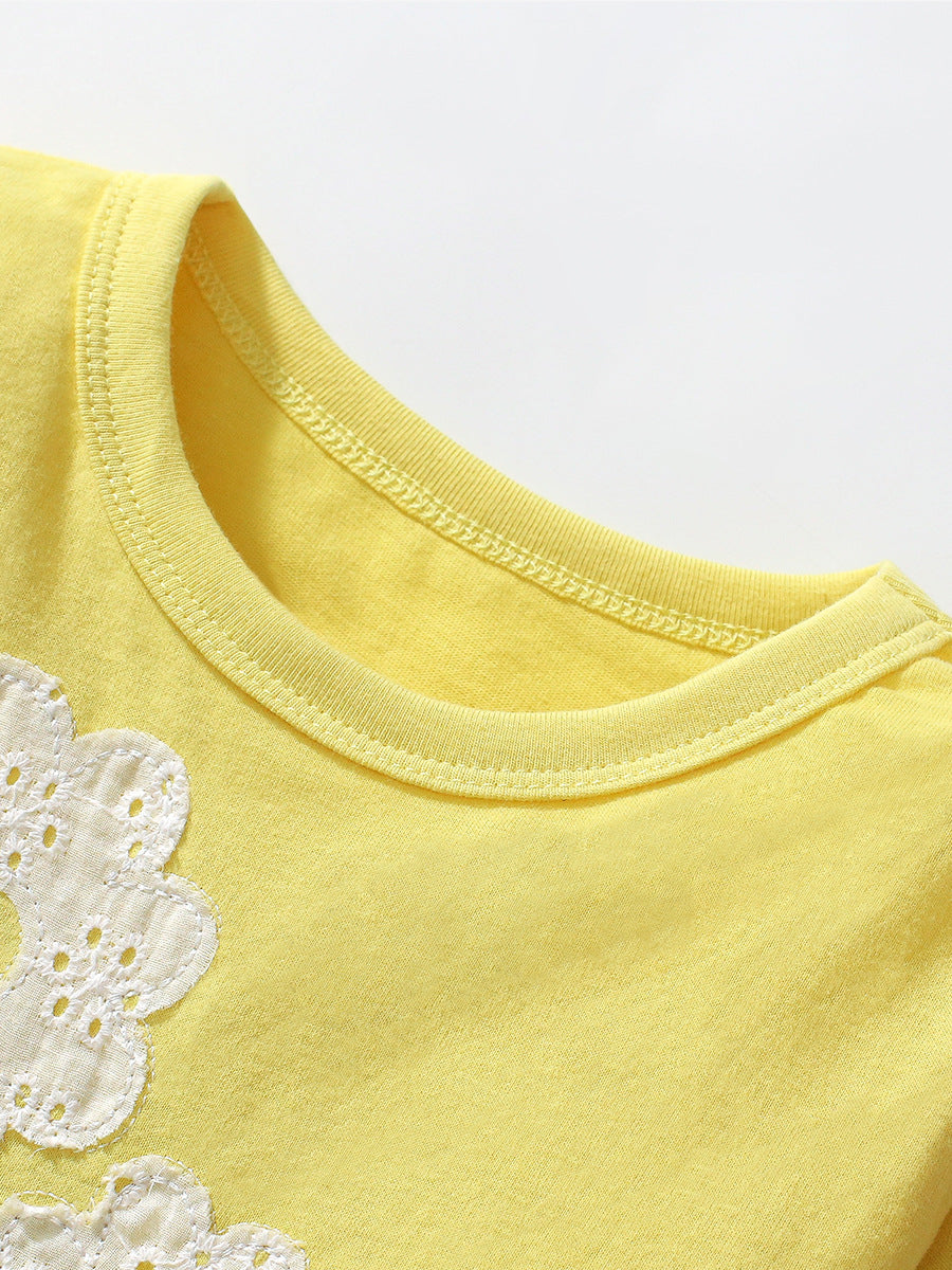 A vibrant yellow long-sleeved t-shirt for girls featuring a cute floral pattern, made from soft cotton, perfect for spring and autumn wear.